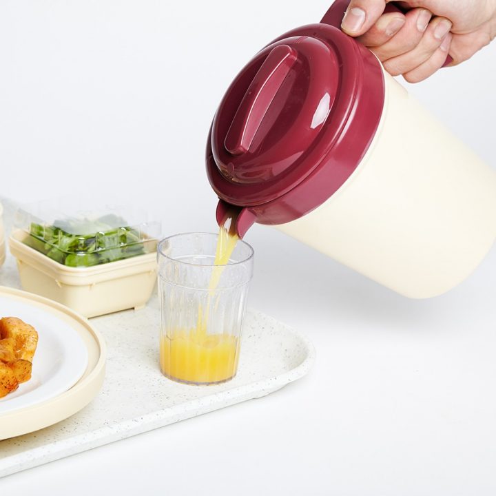 KH Traditional Insulated Jug Burgundy Lid Action In Use